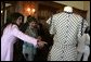 Mrs. Laura Bush is shown a dress worn by former Argentine First Lady Eva Peron as the U.S. First Lady participated in a luncheon Saturday, Nov. 5, 2005, in Mar del Plata that included a display of important Argentine women. White House photo by Krisanne Johnson