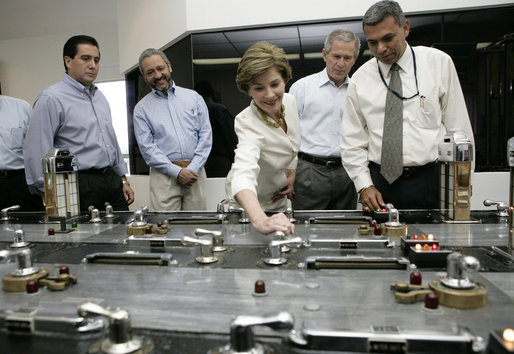 Laura Bush with President George W. Bush turns a knob during a tour of the operations center of the Panama Canal's Miraflores Locks in Panama City, Panama, Monday, Nov. 7, 2005. White House photo by Eric Draper