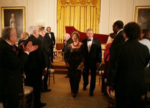 President George W. Bush and Mrs. Laura Bush are applauded at the conclusion of festivities at the White House, Thursday, Nov. 10, 2005, following the evening's celebration of the 40th Anniversary of the National Endowment for the Arts and the National Endowment for the Humanities. White House photo by Paul Morse