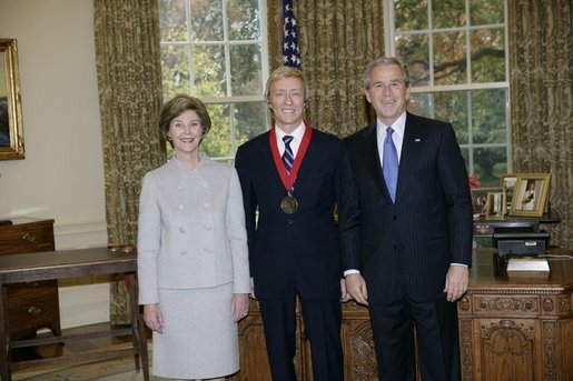 President George W. Bush and Laura Bush stand with 2005 National Humanities Medal recipient Leslie Keno, art historian and appraiser, Thursday, Nov. 10, 2005 in the Oval Office at the White House. White House photo by Eric Draper