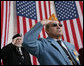 Veterans Jose Garcia, right, and John Rowan, salute Friday, Nov. 11, 2005, during Veterans Day ceremonies at Arlington National Cemetery in Arlington, Va. White House photo by David Bohrer