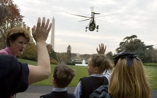 As President Bush departs the South Lawn on Marine One, emotions fly high for families following their meeting with the President and Laura Bush Monday, Nov. 14, 2005. President Bush left for a week-long trip to Asian countries. White House photo by Lynden Steele