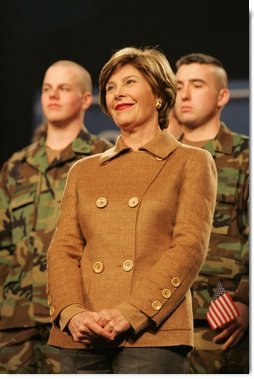 Mrs. Laura Bush smiles as she listens to the President’s introduction Monday, Nov. 14, 2005, at Elmendorf Air Force Base in Anchorage, Alaska, where he delivered remarks on the War on Terror to the troops.  White House photo by Shealah Craighead