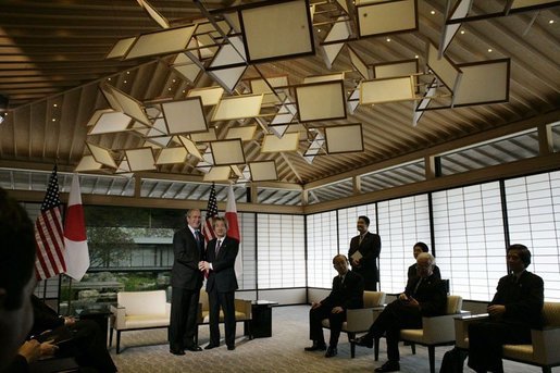 President George W. Bush and Prime Minister of Japan, Junichiro Koizumi, shake hands, Wednesday, Nov. 16, 2005, upon meeting at the Kyoto State Guest House in Kyoto, Japan. White House photo by Eric Draper