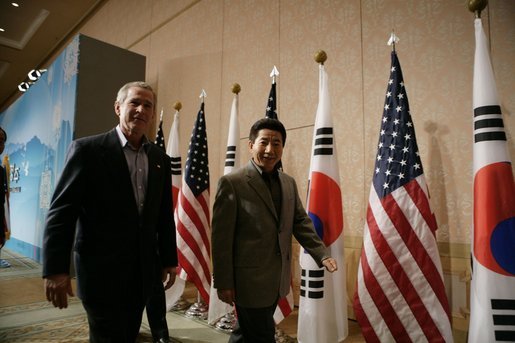 President George W. Bush and Moo Hyun Roh, President of the Republic of Korea, leave the stage at the Hotel Hyundai in Gyeongju, Korea Thursday, Nov. 17, 2005, after a joint press availability. White House photo by Eric Draper
