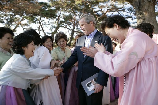 President George W. Bush greets excited participants Thursday, Nov. 17, 2005, during his tour of the Bulguksa Temple in Gyeongju, Korea. White House photo by Eric Draper