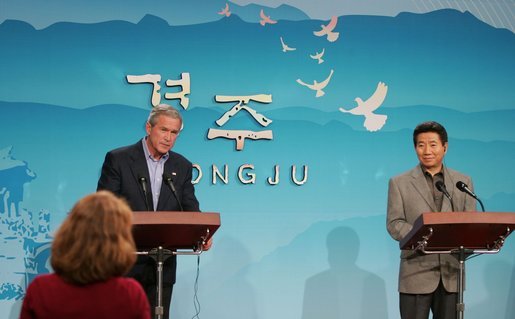 President George W. Bush and Moo Hyun Roh, President of the Republic of Korea, listen to a question from a reporter Thursday, Nov. 17, 2005, during a joint press availability at the Hotel Hyundai in Gyeongju, Korea. White House photo by Paul Morse