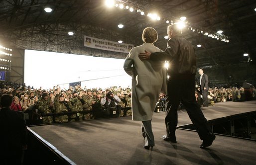 President George W. Bush and Laura Bush enter the Black Cat Hangar at Osan Air Base in Osan, Korea Saturday, Nov. 19, 2005, where the President made remarks to the troops before continuing his Asia tour. White House photo by Eric Draper
