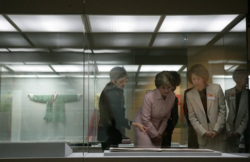Laura Bush is joined by Lisa Vershbow, left, wife of U.S. Ambassador to Korea Alexander Vershbow, as they tour the Busan Museum Saturday, Nov. 19, 2005, in Busan, Korea. White House photo by Shealah Craighead