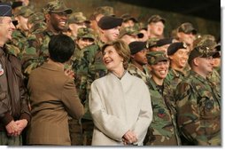 Laura Bush smiles back at the troops Saturday after she and the President stopped en route to China at Osan Air Base in Osan, Korea.  White House photo by Shealah Craighead