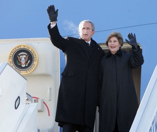 President and Mrs. Bush wave from the top of the steps as they deplane Air Force One Monday, Nov. 21, 2005, in Ulaanbaatar, Mongolia. The stop marks the first time a working U.S. president has visited the country. White House photo by Paul Morse