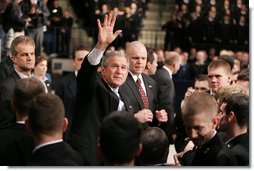 President Bush waves to the crowd after delivering an emphatic statement on the War on Terror Wednesday, Nov. 30, 2005, at the U.S. Naval Academy in Annapolis. "Victory in Iraq will demand the continued determination and resolve of the American people," said the President.  White House photo by Paul Morse