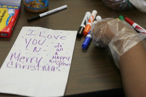 A personal note is written on a sandwich bag by a student Wednesday, Nov. 30, 2005 during a visit to the Church of the Epiphany in Washington by Mrs. Laura Bush, as part of her Helping America's Youth initiative. The students, part of the Youth Service Learning Project, were preparing sandwiches for the homeless. White House photo by Shealah Craighead