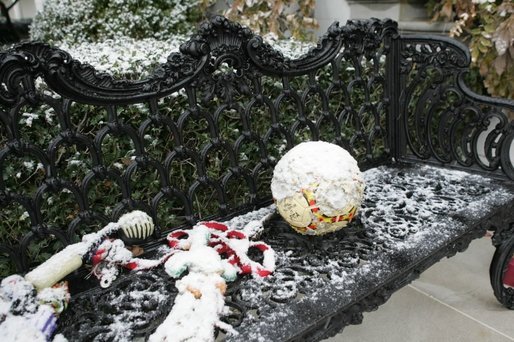 As Barney and Miss Beazley frolic among the holiday decorations, their toys are left outside in the snow Monday, Dec. 5, 2005. White House photo by Shealah Craighead