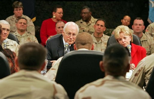 Vice President Dick Cheney and Lynne Cheney sit down and talk with troops from the 42nd Infantry at Fort Drum, N.Y., Tuesday, Dec. 6, 2005. White House photo by David Bohrer