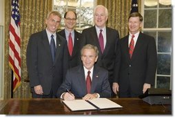 President George W. Bush is joined in the Oval Office, from left to right, by U.S. Rep. Todd Platts, R-Pa., U.S. Rep. Brad Sherman, D-Calif., U.S. Senator John Cornyn, R-Texas, and U.S. Rep. Lamar Smith, R-Texas, at the signing Wednesday, Dec. 14, 2005 of the Executive Order Improving Agency Disclosure of Information.  White House photo by Paul Morse