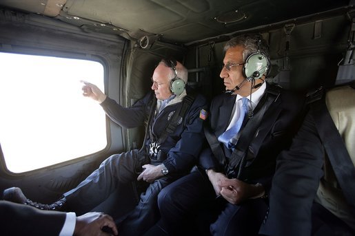 Vice President Dick Cheney and Zalmay Khalilzad, Ambassador to Iraq, depart from Taji Air Base at the 9th Infantry Division Headquarters via helicopter, Sunday Dec. 18, 2005. White House photo by David Bohrer