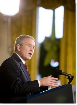 President George W. Bush addresses the media during a press conference Monday, Dec. 19, 2005, in the East Room of the White House. Before responding to reporters' questioning, the President, speaking on Iraq, told the gathering, ". This election does not mean the end of violence, but it is the beginning of something new: A constitutional democracy at the heart of the Middle East."  White House photo by Paul Morse