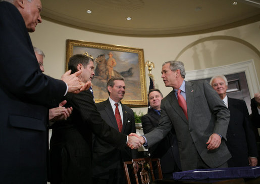 President George W. Bush shakes hands with Senator Bill Frist (R-Tenn.), House Majority Leader, after signing into law H.R. 2520, the Stem Cell Therapeutic and Research Act of 2005, during ceremonies in the Roosevelt Room. White House photo by Paul Morse