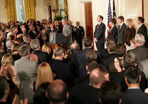 President George W. Bush welcomes an audience to the swearing-in ceremony for U.S. Supreme Court Justice Samuel A. Alito, Tuesday, Feb. 1, 2006 in the East Room of the White House, joined by Altio's wife, Martha-Ann, their son Phil, daughter, Laura, and U.S. Supreme Court Justice John Roberts. White House photo by Shealah Craighead