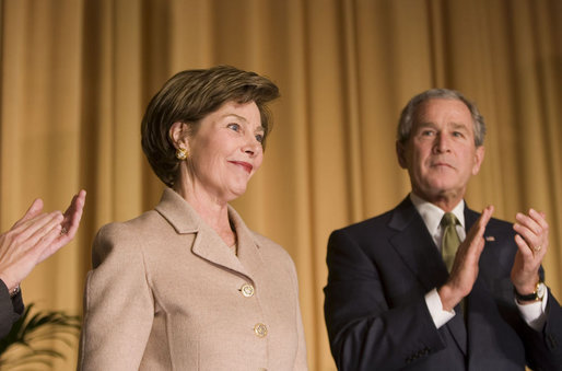 Mrs. Laura Bush acknowledges applause from President George W. Bush and the audience Thursday, Feb. 2, 2006, as she's introduced during the National Prayer Breakfast at the Hilton Washington Hotel. White House photo by Paul Morse