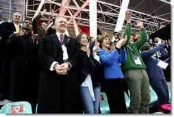 Laura Bush, her daughter, Barbara, and members of the U.S. Olympic Delegation, cheer on American Speed Skater Chad Hedrick Saturday, Feb. 11, 2006, during his heat at the 2006 U.S. Winter Olympics, in Turin, Italy. Hedrick went on to win the first gold medal for the United States.  White House photo by Shealah Craighead