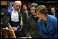 Laura Bush looks at an Ancient Thesis of Montichelli during a tour given by Paolo Novaria, Archives, left, at the University of Turin Saturday, Feb. 11, 2006, in Turin, Italy. White House photo by Shealah Craighead