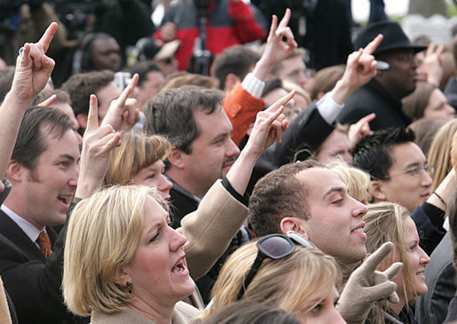 The crowd gives the 'Hook Em Horns' sign, Tuesday, Feb. 14, 2006 on the South Lawn of the White House, during ceremonies to honor the 2005 NCAA Football Champion University of Texas Longhorns. White House photo by Kimberlee Hewitt