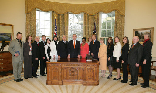President George W. Bush poses with members of President's Council on Service and Civic Participation, Tuesday, Feb. 14, 2006 in the Oval Office of the White House. The council, created by the USA Freedom Corps in 2003, promotes volunteerism and recognizes Americans who serve our communities and the world. White House photo by Paul Morse