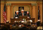 Vice President Cheney recounts his early days in politics during an address to a joint session of the Wyoming State Legislature in Cheyenne, Friday, February 17, 2006. “I would not be where I am today were it not for the friendship and the confidence of people all across this state,” the Vice President said. “It's always good to be home. And this morning, as an officeholder -- and, more than that, as a citizen of Wyoming -- I count it a high honor to be in such distinguished company.” White House photo by David Bohrer