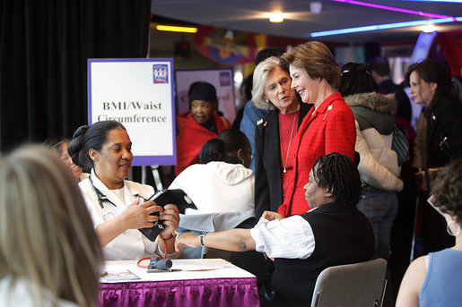 Mrs. Laura Bush is joined by Mrs. Irene Pollin, left, Friday, Feb. 17, 2006, while attending the National Woman's Heart Day Health Fair at the MCI Center in Washington. Mrs. Pollin is the founder and president of Sister to Sister, a national grassroots nonprofit organization offering free heart disease screenings and "heart-healthy" information and support to women to prevent heart disease. White House photo by Shealah Craighead