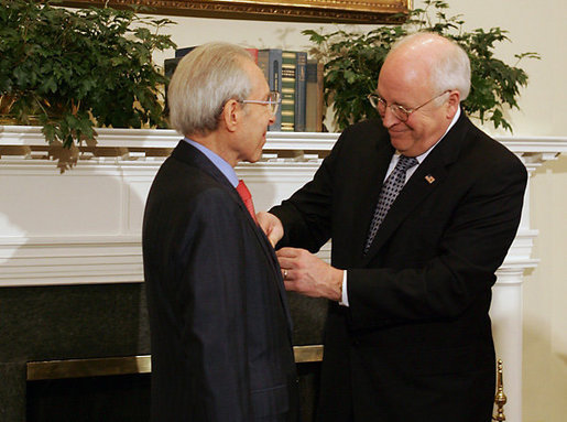 Vice President Dick Cheney presents the Distinguished Service Cross to Lieutenant Bernard W. Bail in the Roosevelt Room at the White House, Friday, February 24, 2006. The Distinguished Service Cross is awarded to a person who while serving in any capacity with the U.S. Army distinguished himself or herself by extraordinary heroism. After Lt. Bail’s aircraft took heavy anti-aircraft fire that killed the pilot and wounded other crew members over the English Channel on June 5, 1944, Lt. Bail displayed such acts of valor and ultimately prevented the aircraft, loaded with a full ordnance, from crashing into an English village. White House photo by David Bohrer