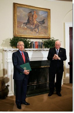 Vice President Dick Cheney applauds Lieutenant Bernard W. Bail, recipient of the Distinguished Service Cross, in the Roosevelt Room at the White House, Friday, February 24, 2006. The Vice President awarded the Distinguished Service Cross to Lt. Bail for his extraordinary acts of heroism during World War II and commended Lt. Bail for being a "brave citizen who elevated service to country above self interest."  White House photo by David Bohrer