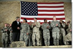 President George W. Bush meets and thanks a group of U.S. and Coalition troops, Wednesday, March 1, 2006, during a visit to Bagram Air Base in Afghanistan, where President Bush thanked the troops for their service in defense of freedom.  White House photo by Eric Draper