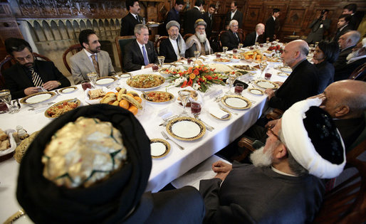 President George W. Bush and President Hamid Karzai of Afghanistan share a working lunch Wednesday, March 1, 2006, at the Presidential Palace in Kabul during a stop by President Bush en route to India. White House photo by Eric Draper