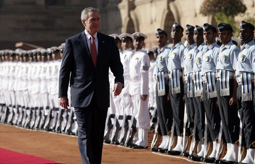 President George W. Bush reviews troops Thursday, March 2, 2006, during the arrival ceremony at Rashtrapati Bhavan, the presidential residence in New Delhi, welcoming he and Laura Bush to India. White House photo by Eric Draper
