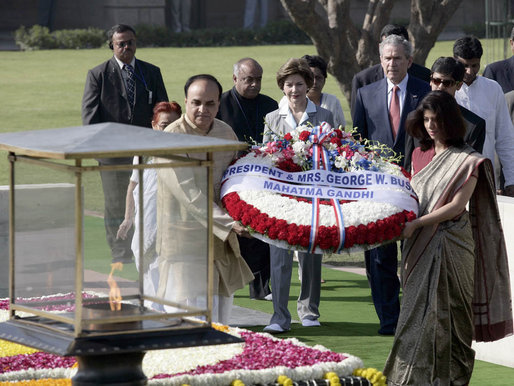 President George W. Bush and Laura Bush participate in a wreath-laying ceremony Thursday, March 2, 2006, in Rajghat, India, at the memorial for Mahatma Gandhi. White House photo by Eric Draper