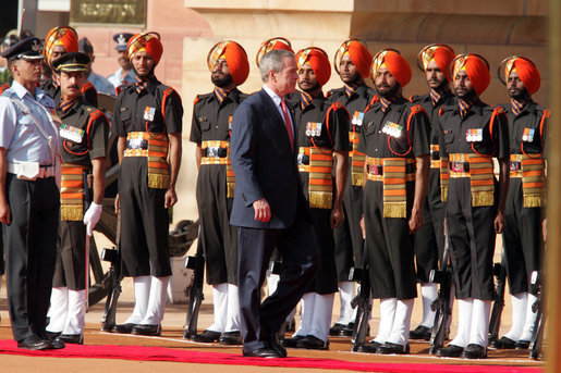 President George W. Bush participates in the troop review Thursday, March 2, 2006, during the arrival ceremony at Rashtrapati Bhavan in New Delhi. White House photo by Paul Morse