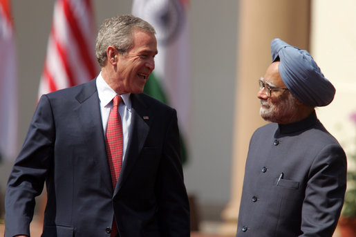 President George W. Bush smiles as he stands with India's Prime Minister Manmohan Singh during a press availability in New Delhi Thursday, March 2, 2006. The President told those in attendance that India and America "have built a strategic partnership based on common values," and thanked the Indian people and the Indian government "for supporting the new democracy in the neighborhood." White House photo by Paul Morse
