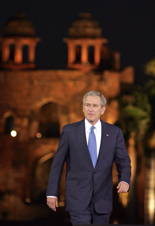 President George W. Bush acknowledges the audience as he arrives for remarks Friday, March 3, 2006, at the Purana Qila in New Delhi. White House photo by Paul Morse