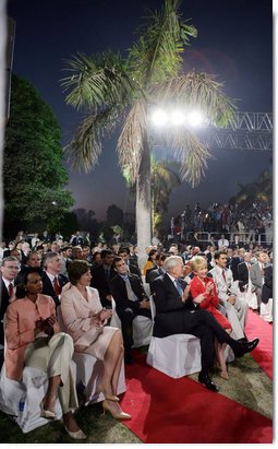 Laura Bush sits with Secretary of State Condoleezza Rice as they listen to President Bush's remarks Friday evening, March 3, 2006, in New Delhi.  White House photo by Shealah Craighead