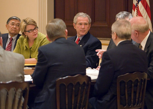 President George W. Bush sits with Secretary of Education Margaret Spellings and Secretary of Transportation Norman Mineta during a drop-by meeting Monday, March 6, 2006, with the Academic Competitiveness Council in the Eisenhower Executive Office Building. White House photo by Kimberlee Hewitt