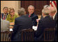 President George W. Bush sits with Secretary of Education Margaret Spellings and Secretary of Transportation Norman Mineta during a drop-by meeting Monday, March 6, 2006, with the Academic Competitiveness Council in the Eisenhower Executive Office Building. White House photo by Kimberlee Hewitt