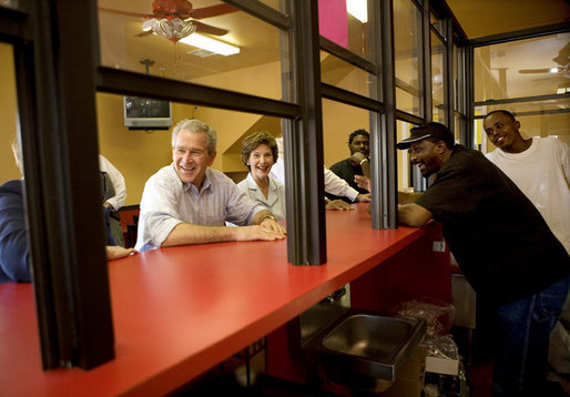 President George W. Bush and Laura Bush stop in at Stewart's Diner in the Ninth Ward of New Orleans, Wednesday, March 8, 2006, during their visit to view the city's reconstruction progress six-months after being devastated by Hurricane Katrina. White House photo by Eric Draper