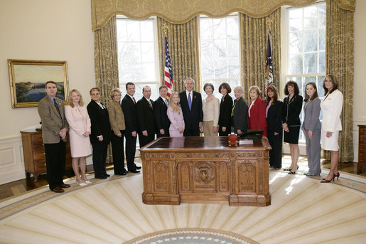 President George W. Bush and Mrs. Laura Bush meet Friday, March 10, 2006 in the Oval Office of the White House, with representatives from various organizations honored for their support the U.S. military. White House photo by Eric Draper