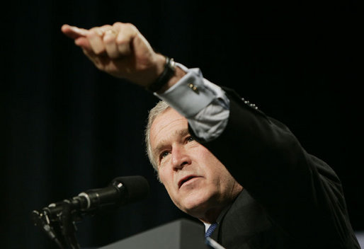 President George W. Bush calls on an audience member to ask a question at the Renaissance Cleveland Hotel in Cleveland, Ohio, following his remarks on the global war on terror, Monday, March 20, 2006, to members of the City Club of Cleveland. White House photo by Paul Morse