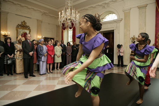 President George W. Bush and Mrs. Laura Bush join Liberia's President Ellen Johnson Sirleaf in viewing a dance performance by Moving in the Spirit, on the State Floor of the White House, Tuesday, March 21, 2006, prior to a social luncheon in honor of President Sirleaf. White House photo by Eric Draper