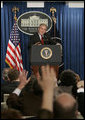 President George W. Bush answers reporters questions, Tuesday morning, March 21, 2006, during a news briefing at the White House. White House photo by Paul Morse