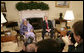 President George W. Bush and Liberia's President Ellen Johnson Sirleaf speak to reporters in the Oval Office at the White House, Tuesday, March 21, 2006. President Sirleaf, the first woman elected President to any country on the continent of Africa, thanked President Bush, the American people and the U.S. Congress for helping support Liberia's transition from war to peace. White House photo by Eric Draper