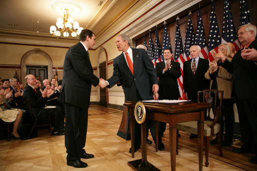 President George W. Bush shakes hands with Ukrainian Ambassador Oleh Shamshur, after President Bush signed H.R. 1053, to authorize the Extension of Nondiscriminatory Treatment to the Products of Ukraine, Thursday, March 23, 2006, in the Eisenhower Executive Office Building in Washington. President Bush was joined at the ceremony by legislators, U.S. Sen. Richard Lugar, R- Ind.; U.S. Rep. Jim Gerlach, R-Pa.; U.S. Rep. Tom Lantos, D-Calif.; U.S. Rep. Candice Miller, R-Mich; U.S. Rep. Curt Weldon, R-Pa., and U.S. Rep. Mike Fitzpatrick, R-Pa. White House photo by Kimberlee Hewitt
